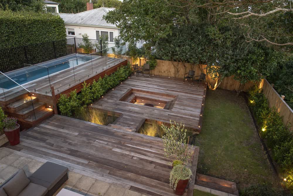 Stained deck with sunken seating and pool access steps